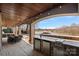 Outdoor kitchen with granite counters, and lake view at 19107 Wildcat Trl, Davidson, NC 28036