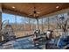 Relaxing screened porch with wicker furniture and lake views at 19107 Wildcat Trl, Davidson, NC 28036