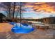 Luxury pool and spa with stunning sunset and lake views at 19107 Wildcat Trl, Davidson, NC 28036