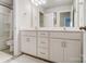 Bathroom boasts double vanity and a soaking tub at 19117 Hawk Haven Ln, Charlotte, NC 28278