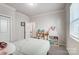 Cozy bedroom with a double bed, window, and play area at 19117 Hawk Haven Ln, Charlotte, NC 28278