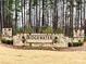 Community entrance sign for Ridgewater, featuring stonework and elegant lighting at 19117 Hawk Haven Ln, Charlotte, NC 28278