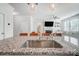 Granite countertop kitchen island with stainless steel sink, and modern pendant lighting at 19117 Hawk Haven Ln, Charlotte, NC 28278