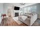 Living room with a gas fireplace, large sectional sofa, and hardwood floors at 19117 Hawk Haven Ln, Charlotte, NC 28278