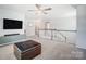 Upstairs loft area with a TV and comfortable seating at 19117 Hawk Haven Ln, Charlotte, NC 28278