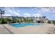 Community swimming pool with adjacent patio and cabana at 19117 Hawk Haven Ln, Charlotte, NC 28278