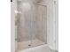 Clean shower with glass enclosure and marble tile at 19117 Hawk Haven Ln, Charlotte, NC 28278