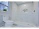 Clean bathroom with a large walk-in shower and marble tile at 2025 Sloan Dr, Charlotte, NC 28208