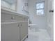 Bathroom boasts a vanity with marble countertop and floor at 2025 Sloan Dr, Charlotte, NC 28208