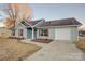 Newly built home with gray siding, brown shutters, and a landscaped yard at 2025 Sloan Dr, Charlotte, NC 28208