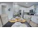 Dining area view of kitchen with stainless steel appliances and white cabinetry at 2025 Sloan Dr, Charlotte, NC 28208