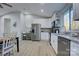 Modern kitchen with white cabinets, stainless steel appliances, and granite countertops at 2025 Sloan Dr, Charlotte, NC 28208