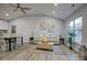 Open living room with vaulted ceiling, dining area and large window at 2025 Sloan Dr, Charlotte, NC 28208