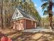 Brick detached garage with a dormer window at 2044 Standing Timber Rd, Lancaster, SC 29720