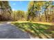 Long driveway leading to a home surrounded by trees at 2044 Standing Timber Rd, Lancaster, SC 29720