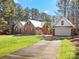 Brick home with attached garage and spacious driveway at 2044 Standing Timber Rd, Lancaster, SC 29720