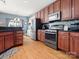 Modern kitchen with stainless steel appliances and wood cabinets at 2044 Standing Timber Rd, Lancaster, SC 29720