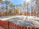 Frozen pond view from backyard with snow on ground at 2044 Standing Timber Rd, Lancaster, SC 29720