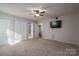 Bright bedroom featuring a large TV and built-in wardrobe at 209 Meadowridge Dr, Maiden, NC 28650