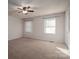 Spacious bedroom with ample closet space and neutral carpeting at 209 Meadowridge Dr, Maiden, NC 28650