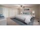 Virtually staged bedroom, featuring a king-size bed and ample closet space at 209 Meadowridge Dr, Maiden, NC 28650