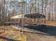 Covered carport provides shelter for a vehicle at 209 Meadowridge Dr, Maiden, NC 28650