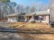 Beige house with red shutters, attached garage, and front porch at 209 Meadowridge Dr, Maiden, NC 28650