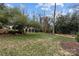 Landscaped backyard with spacious lawn and raised garden beds at 2130 Ferncliff Rd, Charlotte, NC 28211