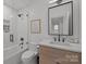 Clean bathroom, featuring a shower/tub combo, and modern vanity at 2130 Ferncliff Rd, Charlotte, NC 28211