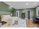 Bedroom with a queen-size bed and built-in workspace at 2130 Ferncliff Rd, Charlotte, NC 28211