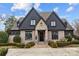 Brick and stone two-story home with landscaping at 2130 Ferncliff Rd, Charlotte, NC 28211