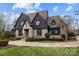 Stunning two-story home with stone and dark siding at 2130 Ferncliff Rd, Charlotte, NC 28211