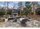 Outdoor fireplace and seating area, perfect for gatherings at 2130 Ferncliff Rd, Charlotte, NC 28211