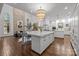 Modern kitchen with white cabinets and large island at 2130 Ferncliff Rd, Charlotte, NC 28211