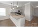 Modern kitchen island with granite countertop and pendant lights at 2234 Catawba Trace Dr, Catawba, NC 28609