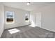 Spacious bedroom with gray carpet and two windows at 2242 Catawba Trace Dr, Catawba, NC 28609