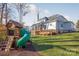 Large backyard with playset and home view at 225 South Shore Dr, Belmont, NC 28012