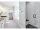 Modern bathroom with a walk-in shower, soaking tub, and patterned tile at 225 South Shore Dr, Belmont, NC 28012