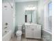 Clean bathroom with a shower/tub combo and white vanity at 225 South Shore Dr, Belmont, NC 28012