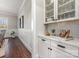 Built-in white cabinetry with glass-front doors and quartz countertops at 225 South Shore Dr, Belmont, NC 28012