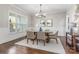 Formal dining room with hardwood floors, wainscoting, and a chandelier at 225 South Shore Dr, Belmont, NC 28012