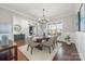 Formal dining room with hardwood floors, chandelier, and built-in shelving at 225 South Shore Dr, Belmont, NC 28012