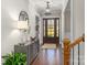 Bright entryway with hardwood floors, a console table, and a large mirror at 225 South Shore Dr, Belmont, NC 28012