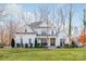 Two-story white farmhouse with covered porch at 225 South Shore Dr, Belmont, NC 28012