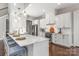 Modern kitchen with white cabinets, quartz countertops, and a large island at 225 South Shore Dr, Belmont, NC 28012