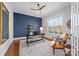 Bright home office features hardwood floors, a ceiling fan, and a blue accent wall at 225 South Shore Dr, Belmont, NC 28012