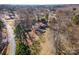 Aerial view of a residential area with homes surrounded by trees at 2407 Brookside Ave, Kannapolis, NC 28081