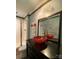 Stylish bathroom featuring a red vessel sink, dark vanity, and a glass-enclosed shower at 2407 Brookside Ave, Kannapolis, NC 28081