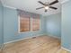 Bedroom with hardwood floors, window and ceiling fan at 2407 Brookside Ave, Kannapolis, NC 28081