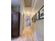 Bright hallway featuring wood-look flooring, neutral paint, and decor at 2407 Brookside Ave, Kannapolis, NC 28081